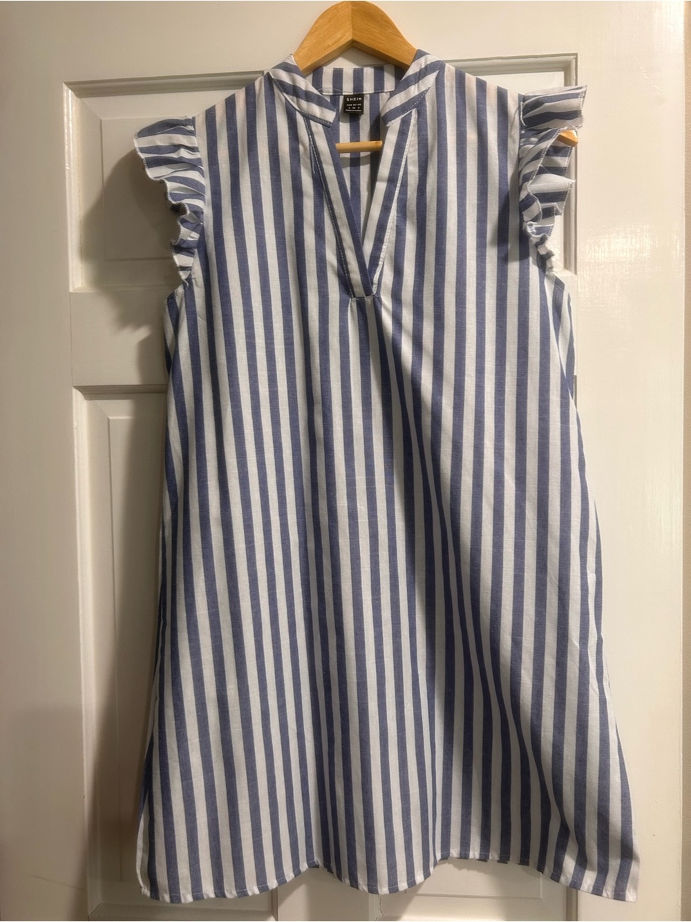 SHEIN Blue and White Vertical Stripe Ruffle Sleeve Dress with ruffle sleeves.